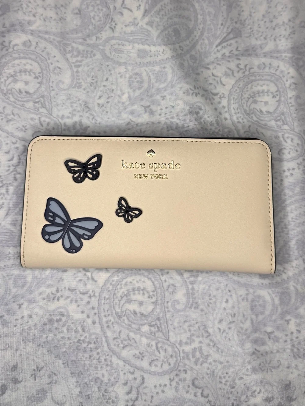kate spade Cream Butterfly Zip Wallet with Navy Accents